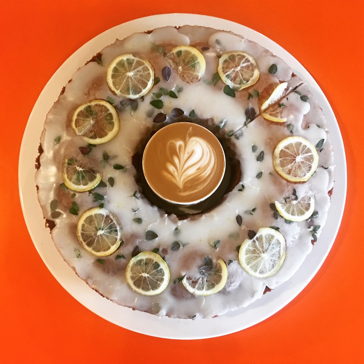 Lemon glazed cake with a flat white at its centre